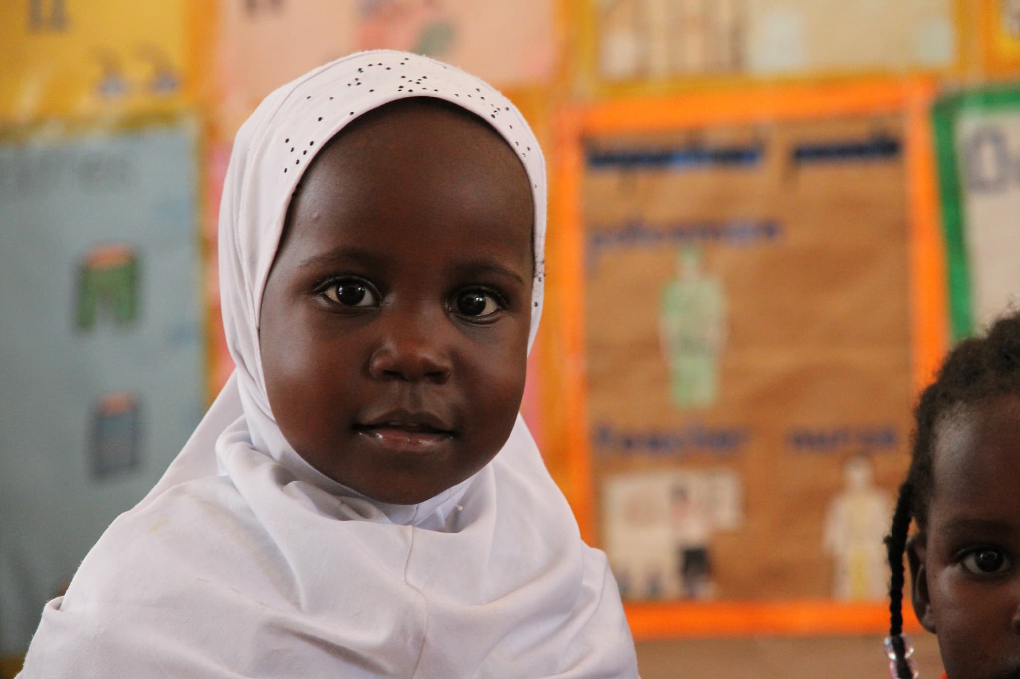 Children in a Muntada Aid classroom