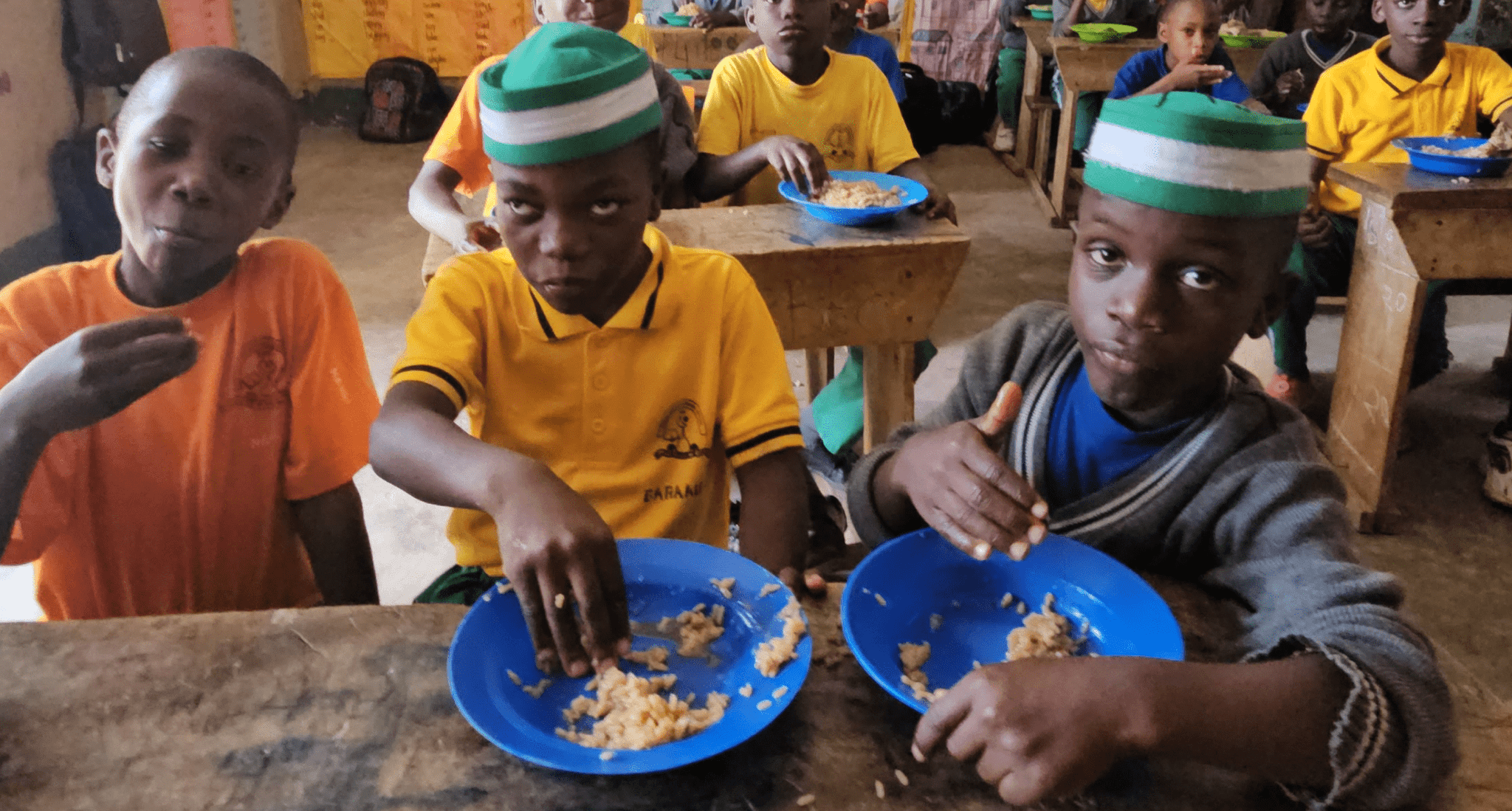 Freshly cooked school meals being served in Uganda